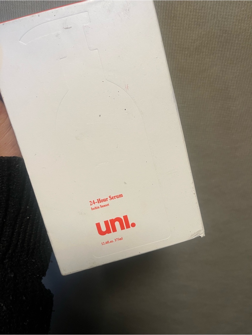 Uni 24-Hour Hydrating Body Serum in the Ischia Sunset scent.